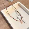 Gekleurde natuurstenen kralenketting met een gouden vlinderhanger in vintage-stijl - Kleurrijke Vlinder Hanger Ketting