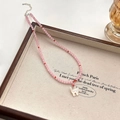 Roze kralenketting met witte schelpen kattenhanger en zilveren verstelbare sluiting - Roze Kattenoog Hanger Ketting