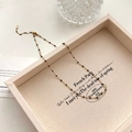 Elegante gouden ketting met kleine zwarte kralen en een handige karabijnsluiting - Zwarte Emaille Kralenketting