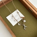 Three-color braided rope necklace with silver deer pendant, pearls, and brown tassel - Dog Tassel / Brown Series