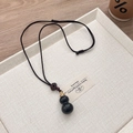 Classical black ebony hollow gourd pendant necklace with a brown hand-woven cord - Ebony Hollow Gourd Necklace (Openable)