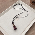 Elegantly hand-carved dark sandalwood gourd pendant on a black woven cord necklace - Red Sandalwood Hollow Gourd Necklace (Openable)