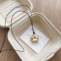 Minimalist matte gold flower pendant necklace with elegant black cord on display - Brushed Gold Flower