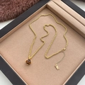 Vintage gouden ketting met tijgeroog hanger aan een gedraaide ketting in een doosje - Lange Tijgeroog Ketting