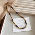 Vintage Tijgeroog kralenketting met hartvormige hanger en bruine edelsteenafwerking - Ketting Met Tijgeroogkralen