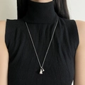 Polished silver teardrop pendant necklace for women on a black turtleneck sweater - Double Drop Fine Chain