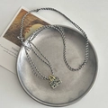 Handmade woven necklace featuring spotted tiger eye stone handbag pendant and gold details - Dalmatian Stone Bag Pendant Necklace