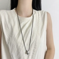 Polished silver water-drop pendant on long black cord necklace for minimalist styling - Lanyard Style
