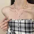 Elegante Y-vormige ketting met zilveren kralen en witte parels voor een luxe look - Glinsterende Ster Parelketting