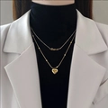 Dubbellaagse gouden titanium ketting met Forever-hanger en gepolijst hartdetail - Dubbellaagse Titanium Staal Letter Hart Ketting