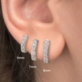 Detailed ear view showing 6mm 7mm and 8mm silver hoop earrings with pink zircon stones - 6mm / Silver with Pink Rhinestone