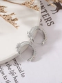 Detailed close-up of silver dragon hoop earrings with pavé set white cubic zirconia - Silver