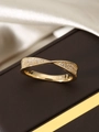 Macro shot of 18k gold plated S925 silver twist ring with shimmering pave zircons - US 6 / Gold