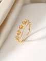 Macro detail of a double-layered gold ring featuring tiny roses and micro-set cubic zirconia - US 6 / Gold