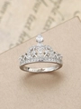 Detailed macro view of a vintage crown ring with polished silver finish and pavé zircons - US 6 / Silver
