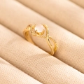Macro shot of minimalist gold ring with moonstone main gem and paved side diamonds - US 6 / Gold