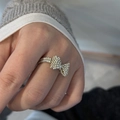 Macro view of handmade silver beaded bow ring showing delicate texture and craftsmanship - Silver Tone Metallic Bead Bowknot Soft Ring / Silver