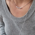 Silver titanium steel necklace with 5 white pearls on a snake chain worn by a woman - Silver Pearl Short Necklace