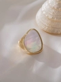 Gold plated titanium steel ring featuring an irregular shell inlay and organic texture - Large Shell Style