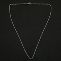 Detail of silver box chain necklace with durable lobster clasp on textured surface - 45cm / Box Chain / Silver
