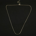 Detail of a shiny gold-plated snake chain necklace with lobster clasp and extension - 45+5cm / Round Snake Chain / 1mm / Gold