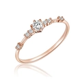 Elegant rose gold diamond ring with a round center stone and pave accents on a white background - US 6 / Rose Gold