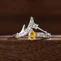 Detail of V-shaped silver crown ring with brilliant yellow pear-cut gemstone and diamonds - US 6 / Yellow