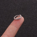 Close-up of s925 silver ear cuff with micro-set cubic zirconia displayed on a fingertip - 1# Silver