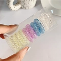 Set of 8 colorful spiral hair ties in a clear box, yellow, pink, blue and transparent - Multicolor Transparent Set