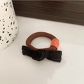 Élastique à cheveux marron avec nœud en velours côtelé noir et étiquette smiley orange - Noir