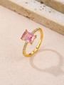 Detail of gold ring with rectangle pink gemstone and side zircon accents on marble background - US 6 / Gold