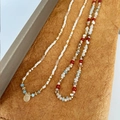 Close-up of bohemian beaded necklaces with colorful natural stones and teardrop pendant - Double Layer Stackable Beaded Necklace Set