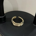 Detailed close-up showing the intricate feather texture of this gold adjustable ring - Gold Feather Ring