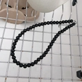 Minimalist black beaded choker necklace with polished obsidian-style beads and silver clasp - Black Artificial Pearl Necklace