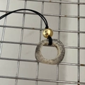 Vintage style camel bone pendant necklace with aged texture and a shiny gold bead - Gold Hollow Copper Bead / Beige Pattern