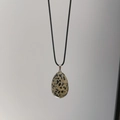 Egg-shaped natural stone pendant necklace with unique black spotted marble texture - Dalmatian Jasper