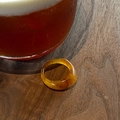 Minimalist wide amber resin ring with tortoise shell pattern on dark wood desk - Irregular Narrow Resin Ring / Brown