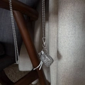 Silver woven basket pendant necklace with metal bead chain and sturdy lobster clasp - White Leather Cord Hollow Metal Bag Necklace