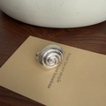 Minimalist silver brass ring featuring a unique 3D spiral shell design and smooth band - Silver Sea Snail (4609)