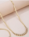 Elegante gouden platte slangenketting met negen sprankelende zirkonia in een boog - Gouden Slangenketting