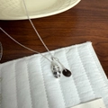 Chic silver coffee cup and bean pendant necklace displayed on a white quilted background - Coffee Bean Necklace Set