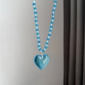 Blue and white beaded necklace with a transparent heart pendant in a minimalist style - Blue Bead Heart Necklace