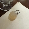 Translucent cream-colored round resin bead ring with minimalist silver-tone setting - Apricot Ring