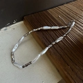 Baroque style necklace featuring irregular white pearls and silver metal beads with lobster clasp - Silver