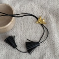 Minimalist golden bird pendant on black leather cord with elegant fringe tassels - Gold Bird Tassel Necklace