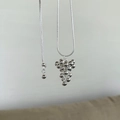 Detailed shot of polished silver spherical grape cluster pendant with smooth snake chain - Grape Cluster Style