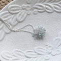 Silver bead necklace featuring a light blue faceted crystal cluster sphere pendant - Blue Crystal Style