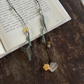 Handmade woven necklace with a silver house pendant and a yellow ceramic star charm - Black Rope With Green Wrap