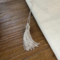 Elegant silver brushed heart pendant necklace with long tassel and spherical bead accents - Tassel Style / Silver