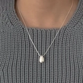 Brushed silver heart necklace with teardrop pendant worn on a grey knit sweater - Silver Plated Waterdrop Style